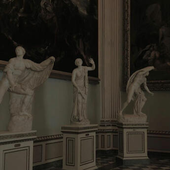 focuses on an open book being held by the passenger of a train. in the background, a rainy scene can be seen racing passedl